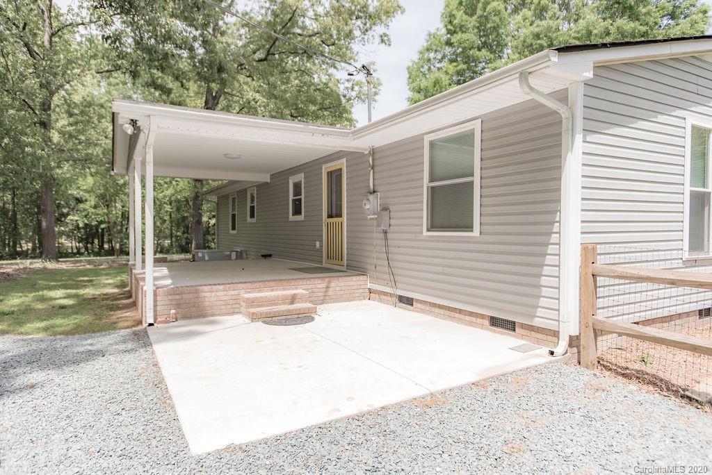 2519 Old Camden Road Monroe, NC 28110 - Photo 34 of 42 a view of a house with backyard and a trees