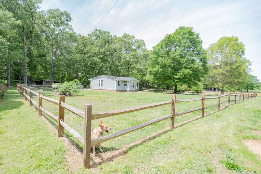 2519 Old Camden Road Monroe, NC 28110 - Photo 40 of 42 a view of a balcony with trees