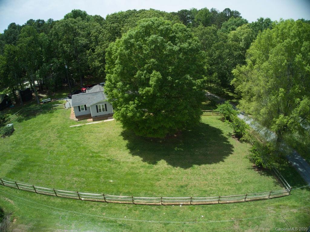 2519 Old Camden Road Monroe, NC 28110 - Photo 7 of 42 a backyard of a house with lots of green space