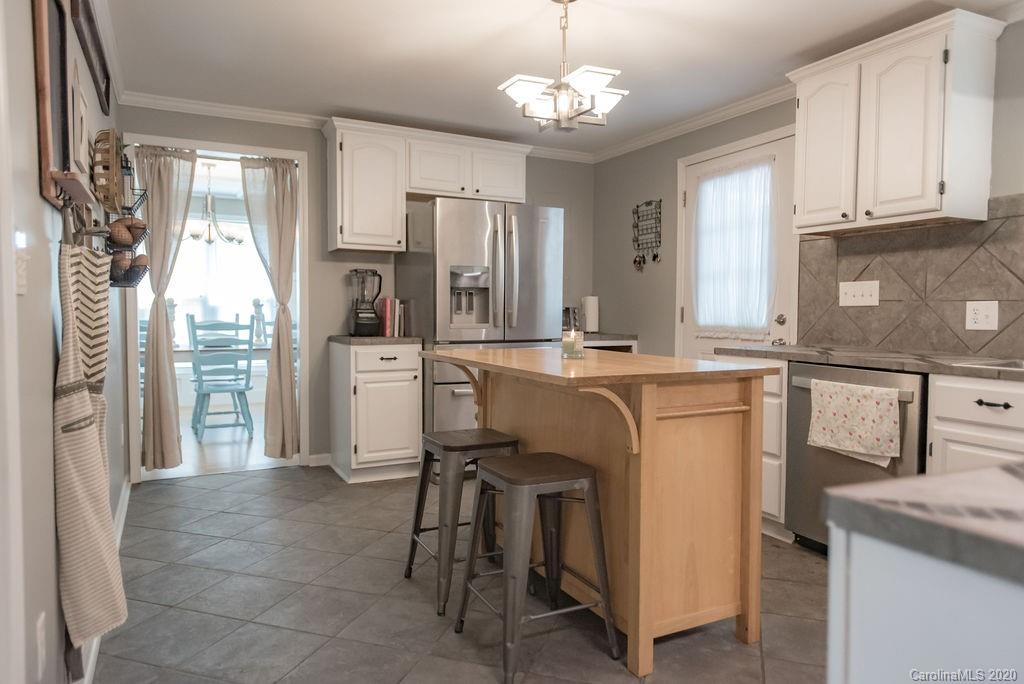2519 Old Camden Road Monroe, NC 28110 - Photo 9 of 42 a kitchen with cabinets and stainless steel appliances