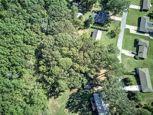 an aerial view of house with yard