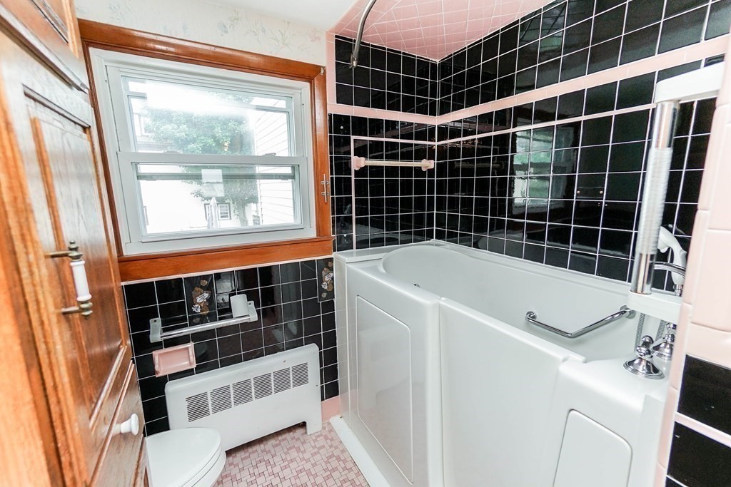 4 Pico Avenue Winthrop, MA 02152 - Photo 23 of 42 a view of a bathroom with tub and window