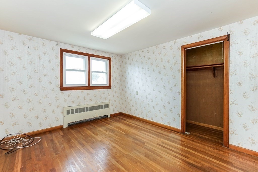 4 Pico Avenue Winthrop, MA 02152 - Photo 24 of 42 an empty room with wooden floor and windows