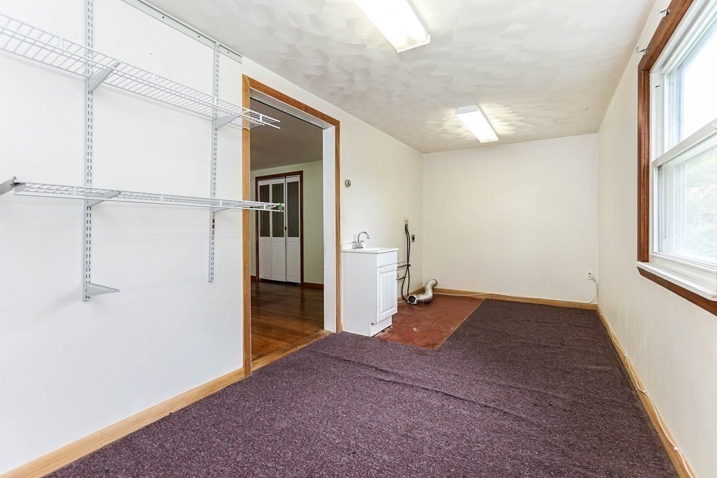 4 Pico Avenue Winthrop, MA 02152 - Photo 30 of 42 an empty room with a window and wooden floor