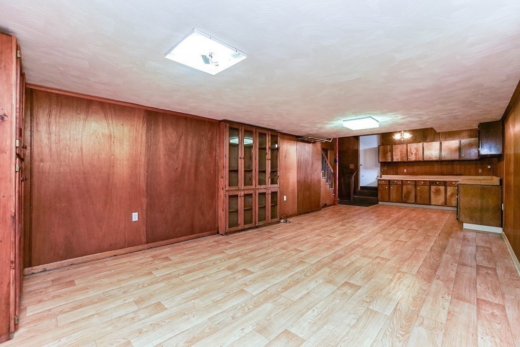 4 Pico Avenue Winthrop, MA 02152 - Photo 31 of 42 a view of an empty room with wooden floor and a window