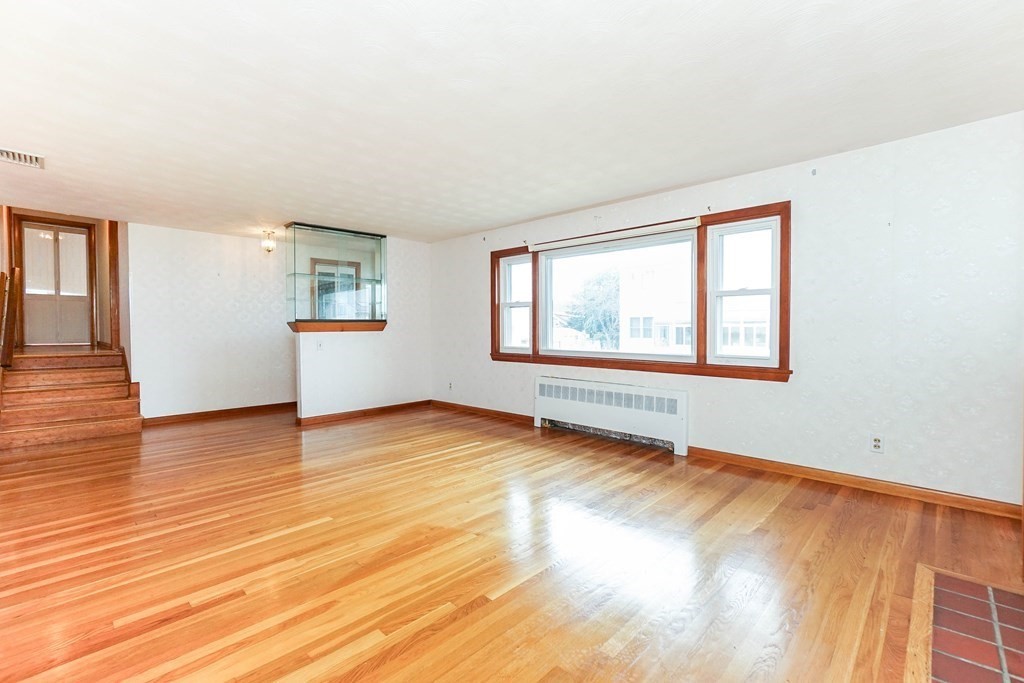 4 Pico Avenue Winthrop, MA 02152 - Photo 4 of 42 a view of empty room with wooden floor and fan