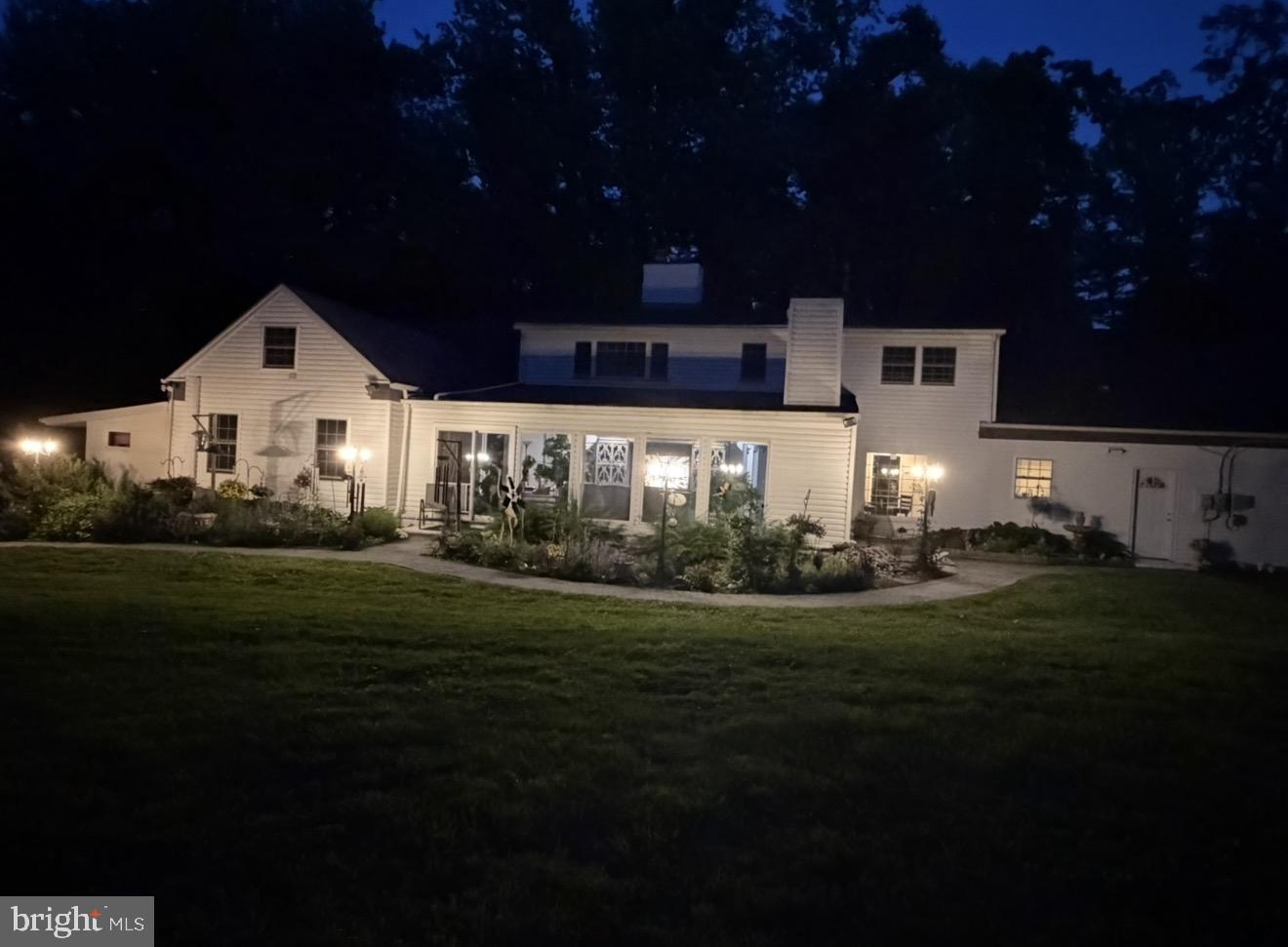 2993 North Providence Road Media, PA 19063 - Photo 41 of 55 a front view of a house with a garden and yard