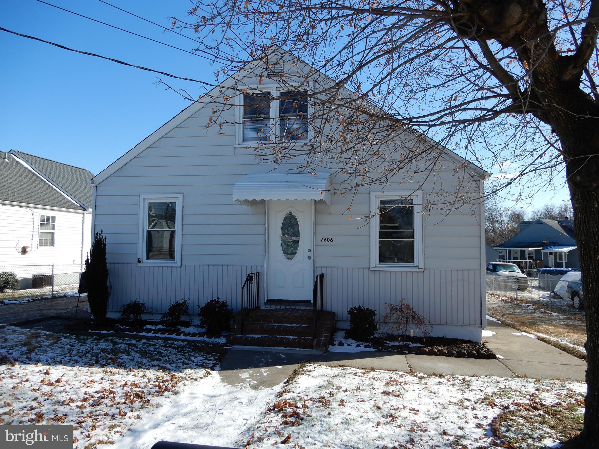7606 Poplar Road Baltimore, MD 21222 - Photo 1 of 18 a front view of a house with a yard
