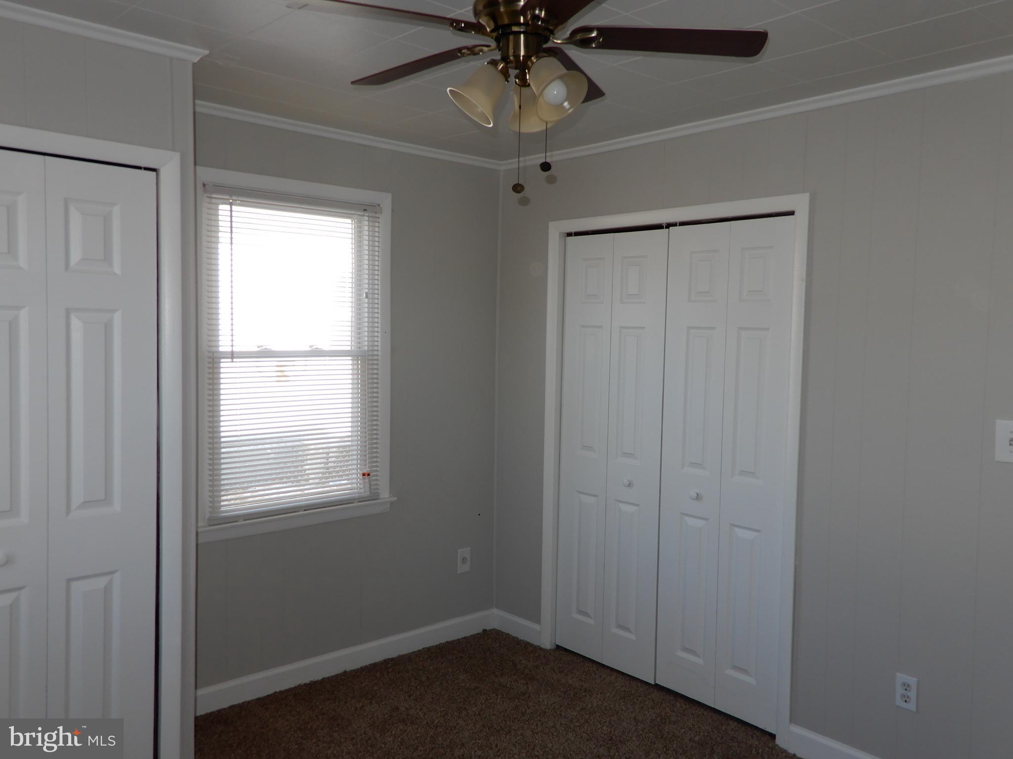 7606 Poplar Road Baltimore, MD 21222 - Photo 14 of 18 an empty room with a window
