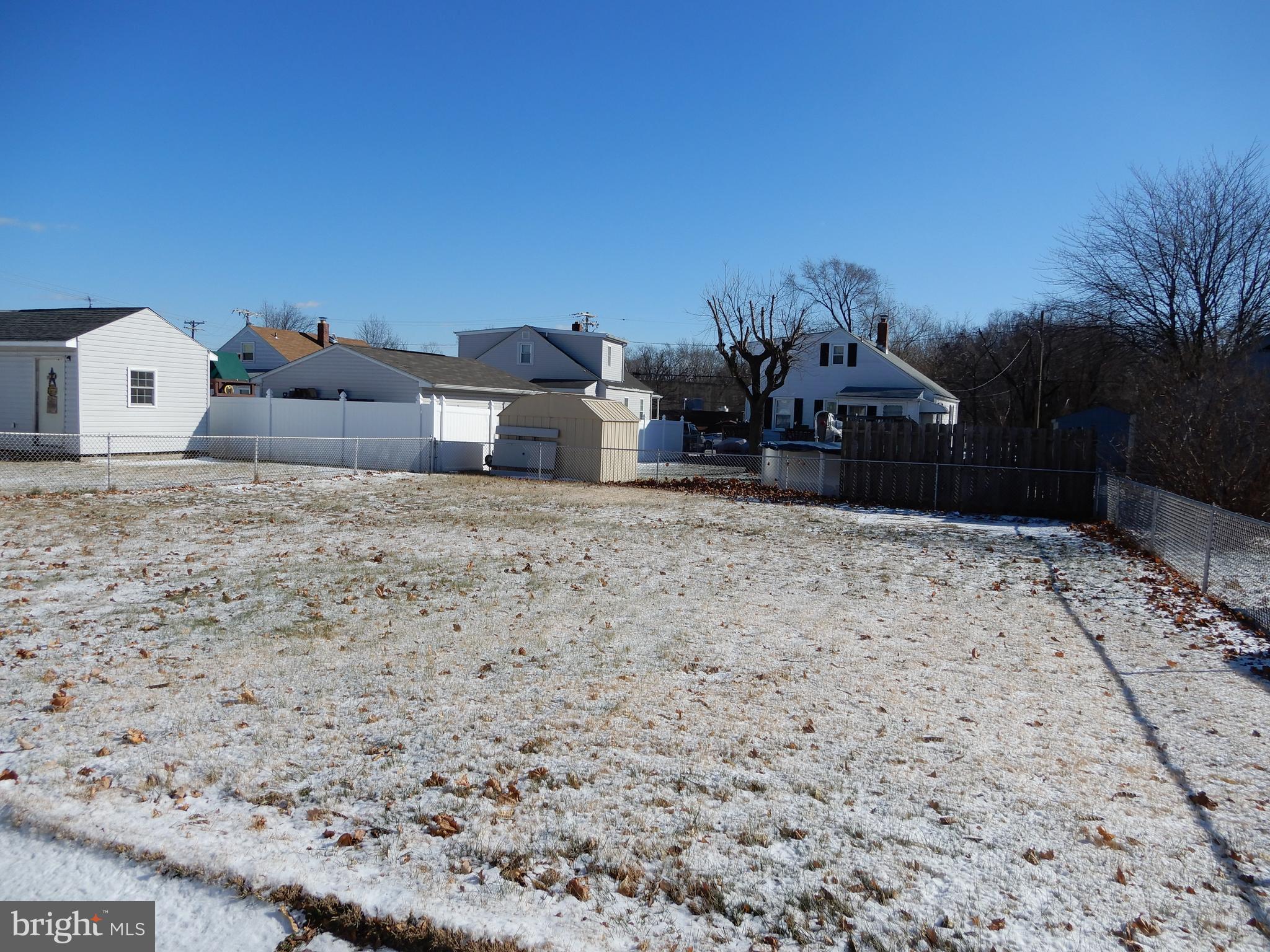 7606 Poplar Road Baltimore, MD 21222 - Photo 3 of 18 a view of a house with a snow in the yard