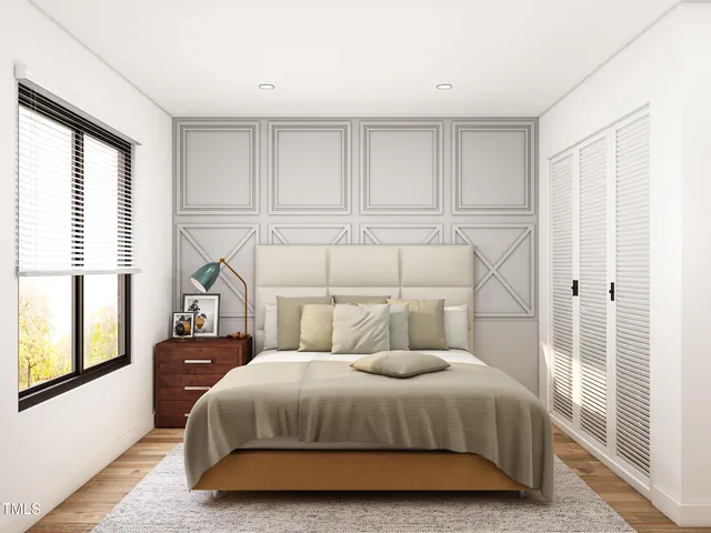 a bedroom with a bed and large window