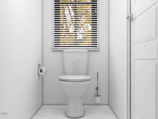 a bathroom with a toilet and a sink