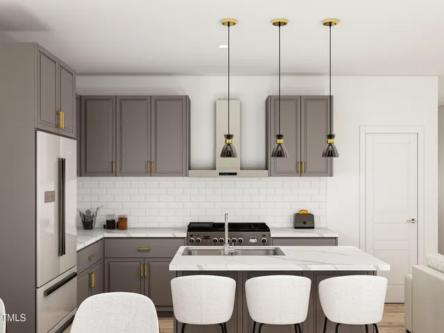 a kitchen with a dining table chairs and white cabinets