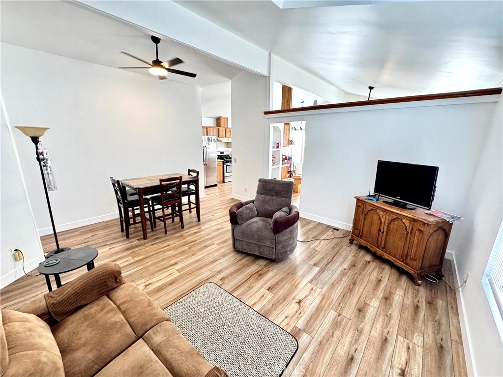 23301 Ridge Rte Drive, Unit 26 Laguna Hills, CA 92653 - Photo 5 of 16 a living room with furniture and a flat screen tv