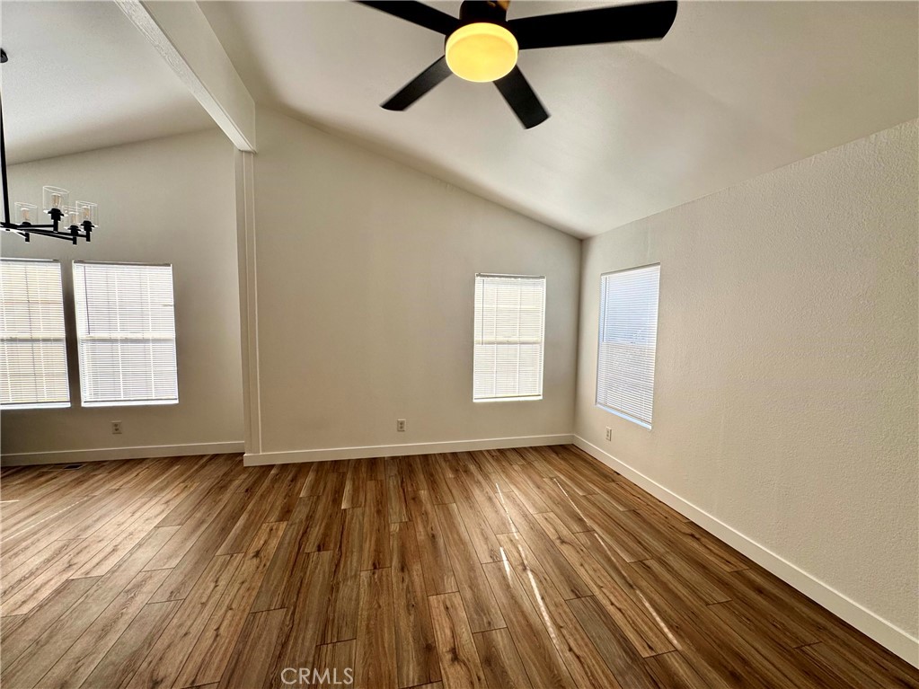 23301 Ridge Rte Drive, Unit 26 Laguna Hills, CA 92653 - Photo 6 of 16 a view of empty room with wooden floor and fan