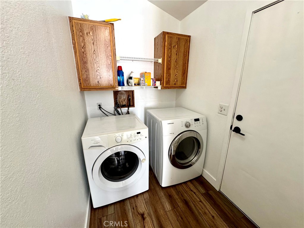 23301 Ridge Rte Drive, Unit 26 Laguna Hills, CA 92653 - Photo 9 of 16 a utility room with dryer and washer