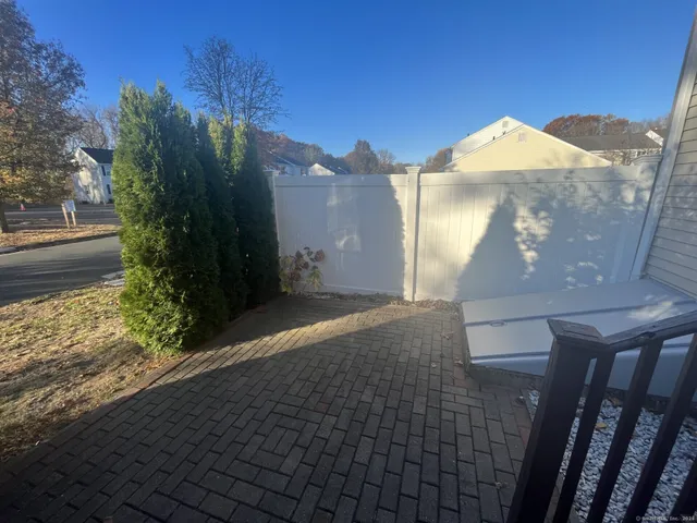 a view of a brick house with a yard