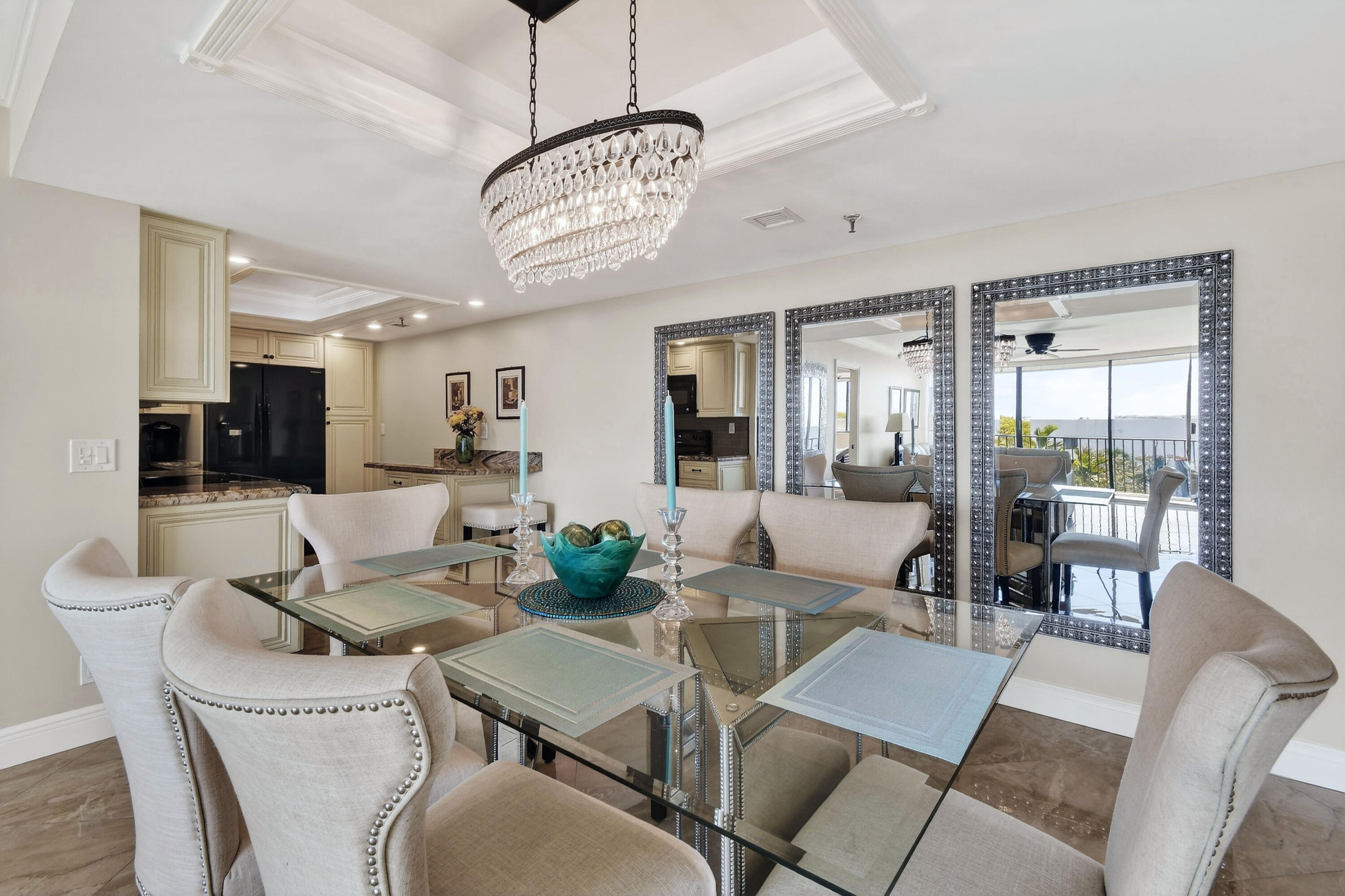 1300 Florida A1A, Unit 320 Jupiter, FL 33477 - Photo 12 of 92 a view of a dining room with furniture wooden floor and chandelier