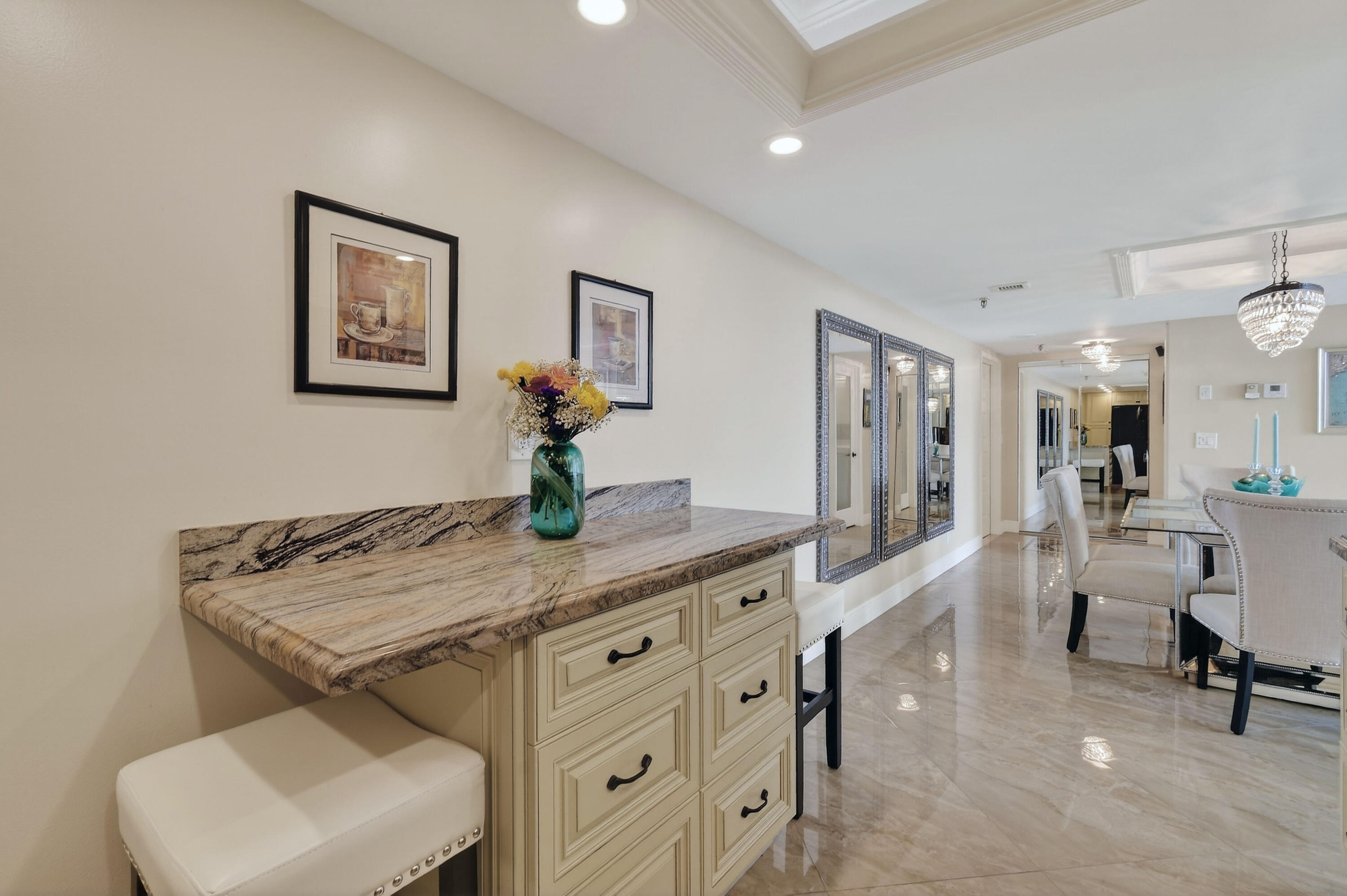 1300 Florida A1A, Unit 320 Jupiter, FL 33477 - Photo 20 of 92 a view of a kitchen area with furniture and wooden floor