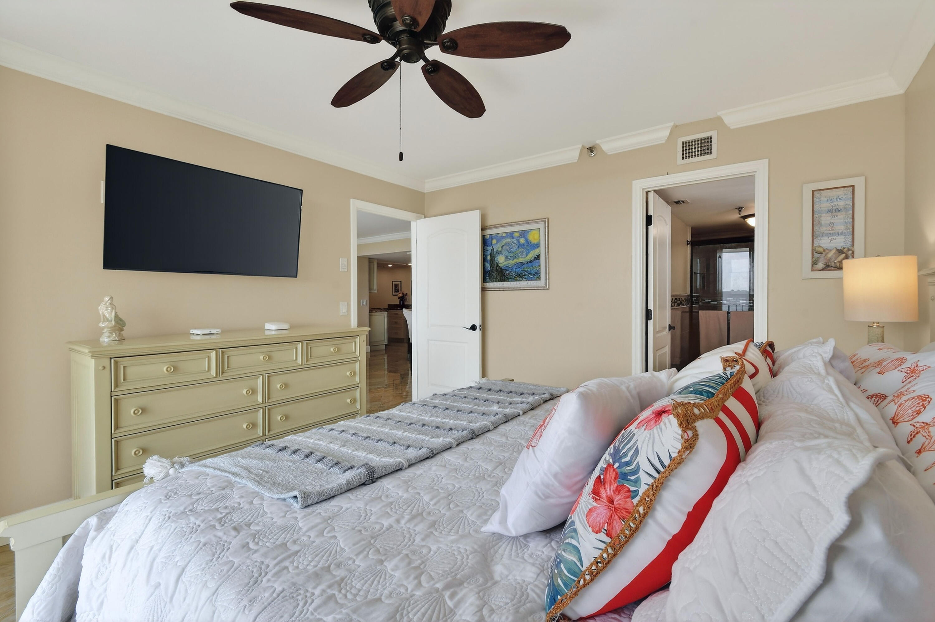 1300 Florida A1A, Unit 320 Jupiter, FL 33477 - Photo 32 of 92 a bedroom with a bed and a flat screen tv