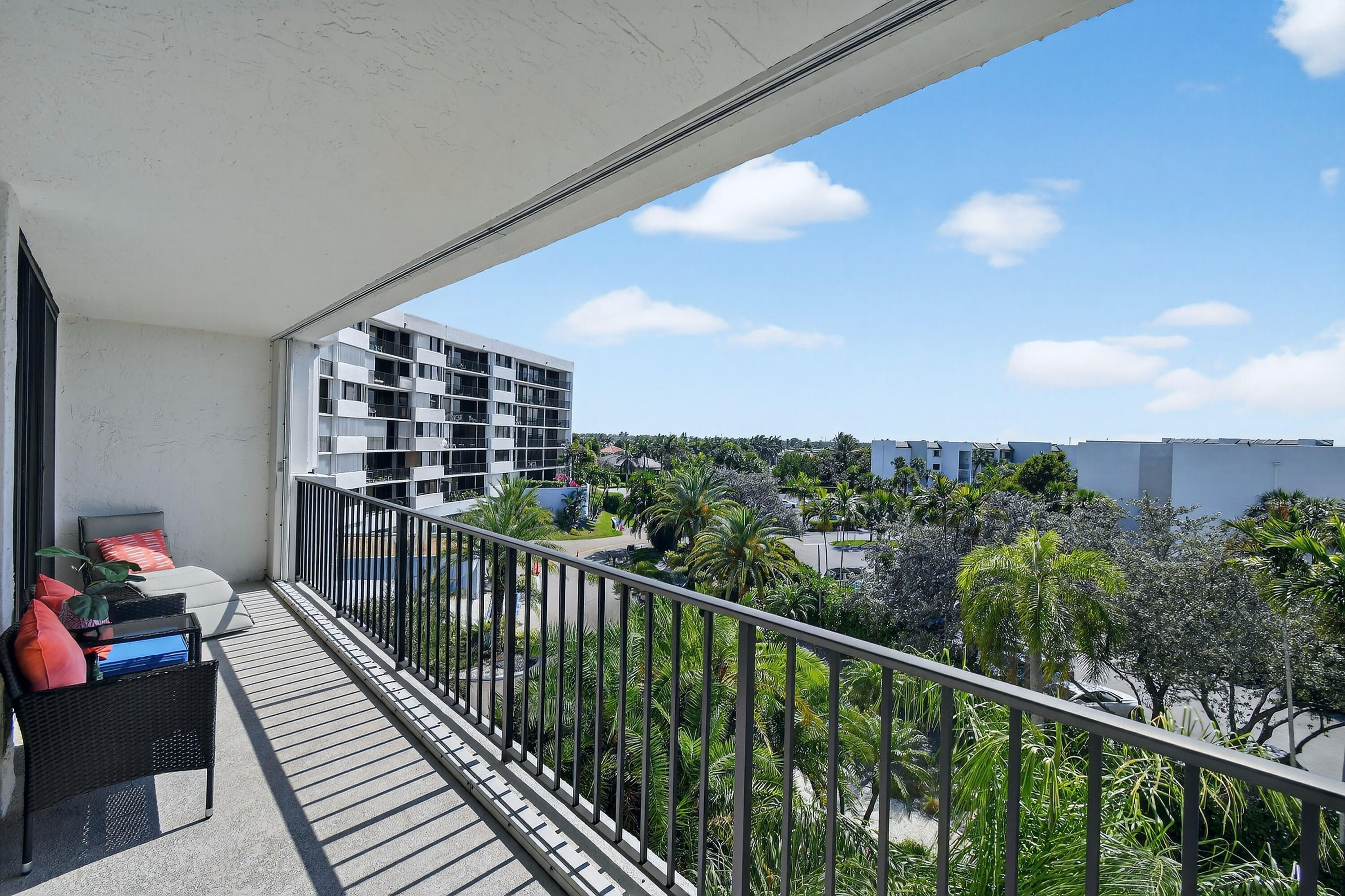 1300 Florida A1A, Unit 320 Jupiter, FL 33477 - Photo 42 of 92 a balcony with wooden floor in front of it