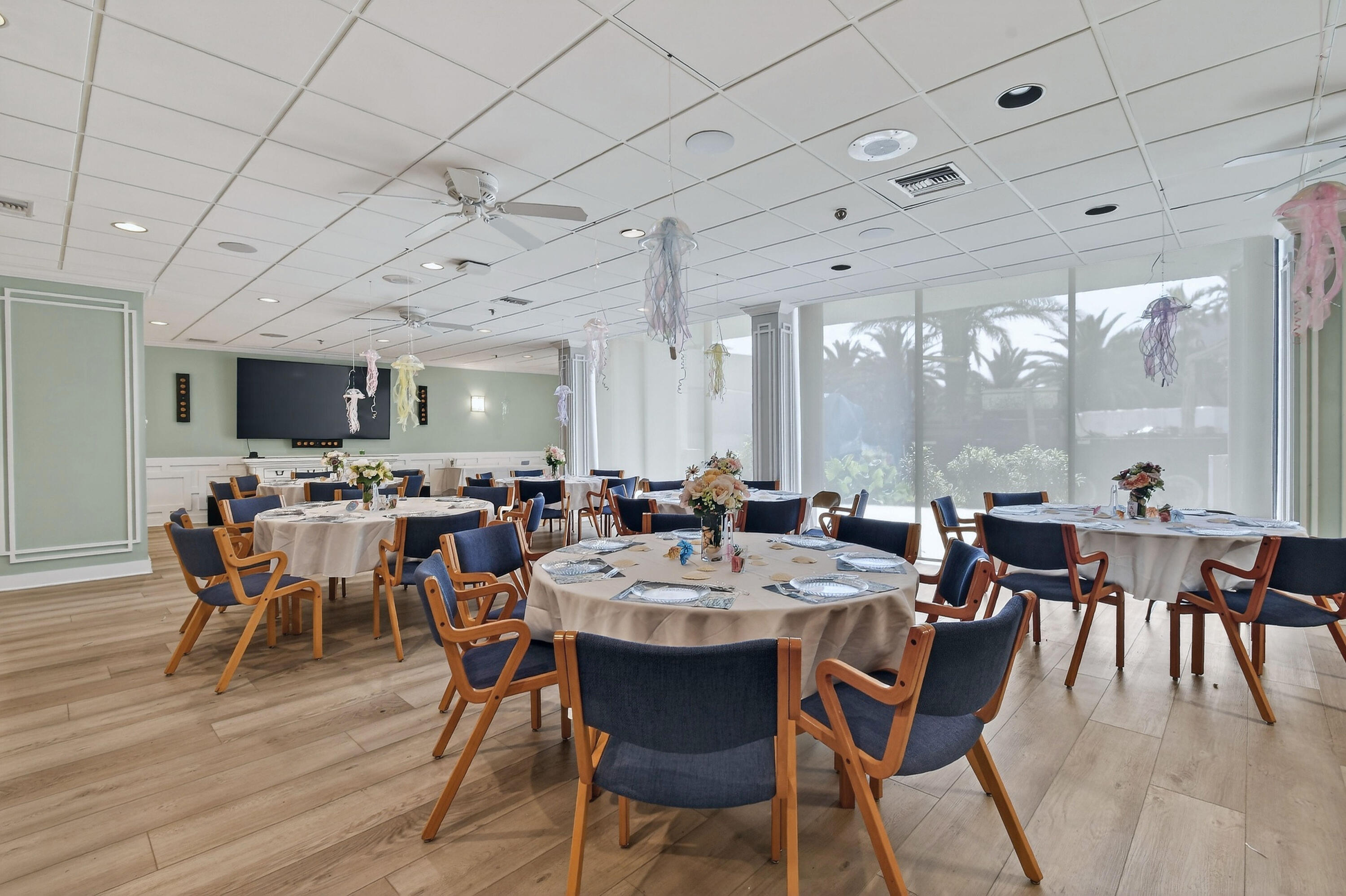 1300 Florida A1A, Unit 320 Jupiter, FL 33477 - Photo 56 of 92 a view of a dining room with furniture window and wooden floor