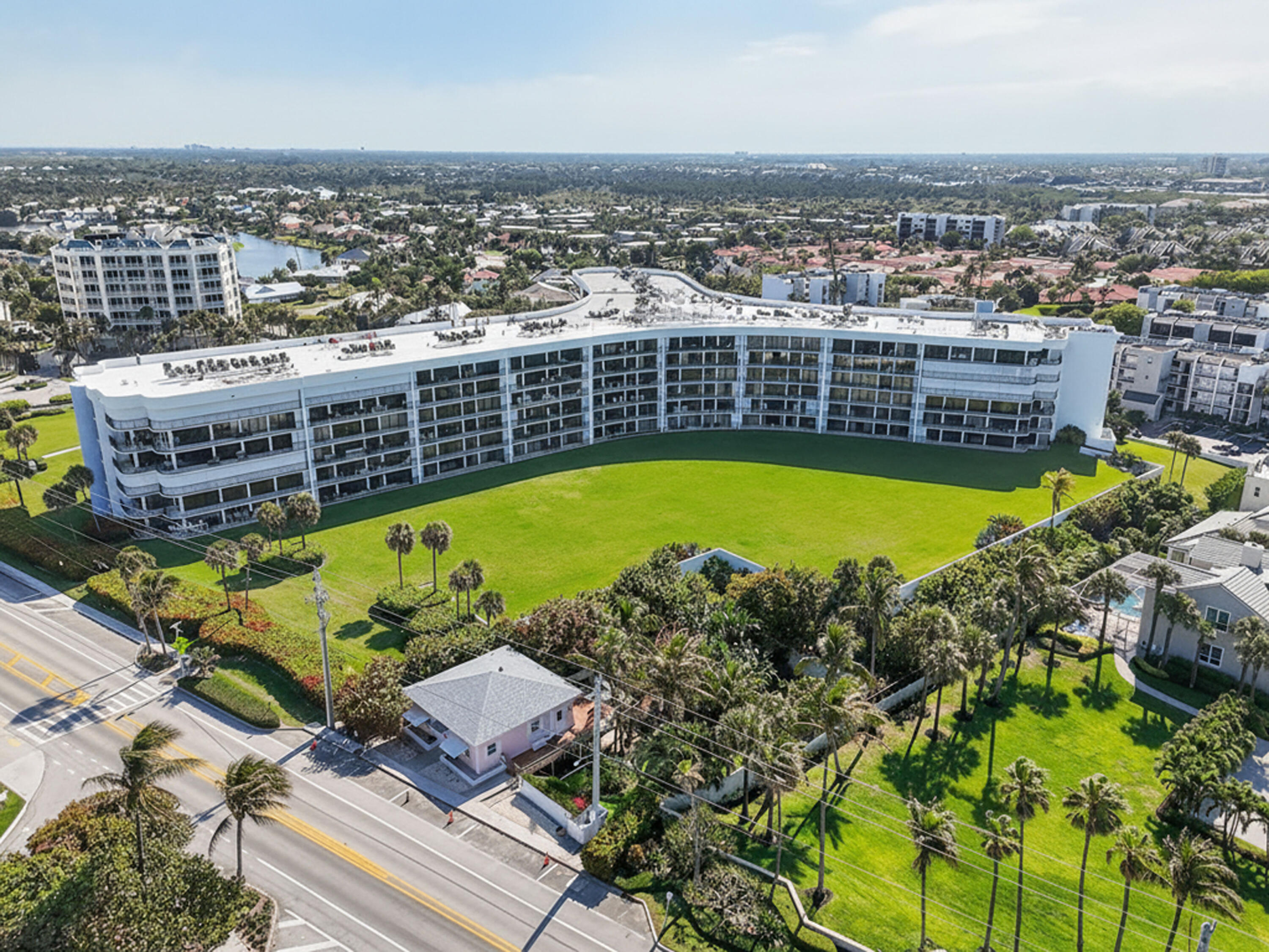 1300 Florida A1A, Unit 320 Jupiter, FL 33477 - Photo 76 of 92 an aerial view of a swimming pool with outdoor seating and yard
