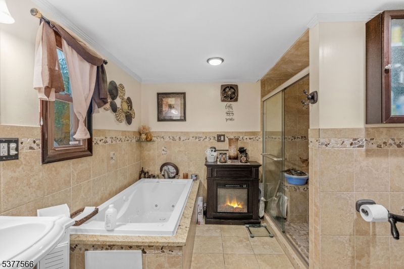 2785 Larchmont Road Union, NJ 07083 - Photo 7 of 15 a bathroom with a granite countertop sink a toilet and a mirror
