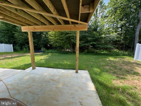 1103 Llano Drive, Unit B La Plata, MD 20646 - Photo 5 of 13 a view of a patio with a yard