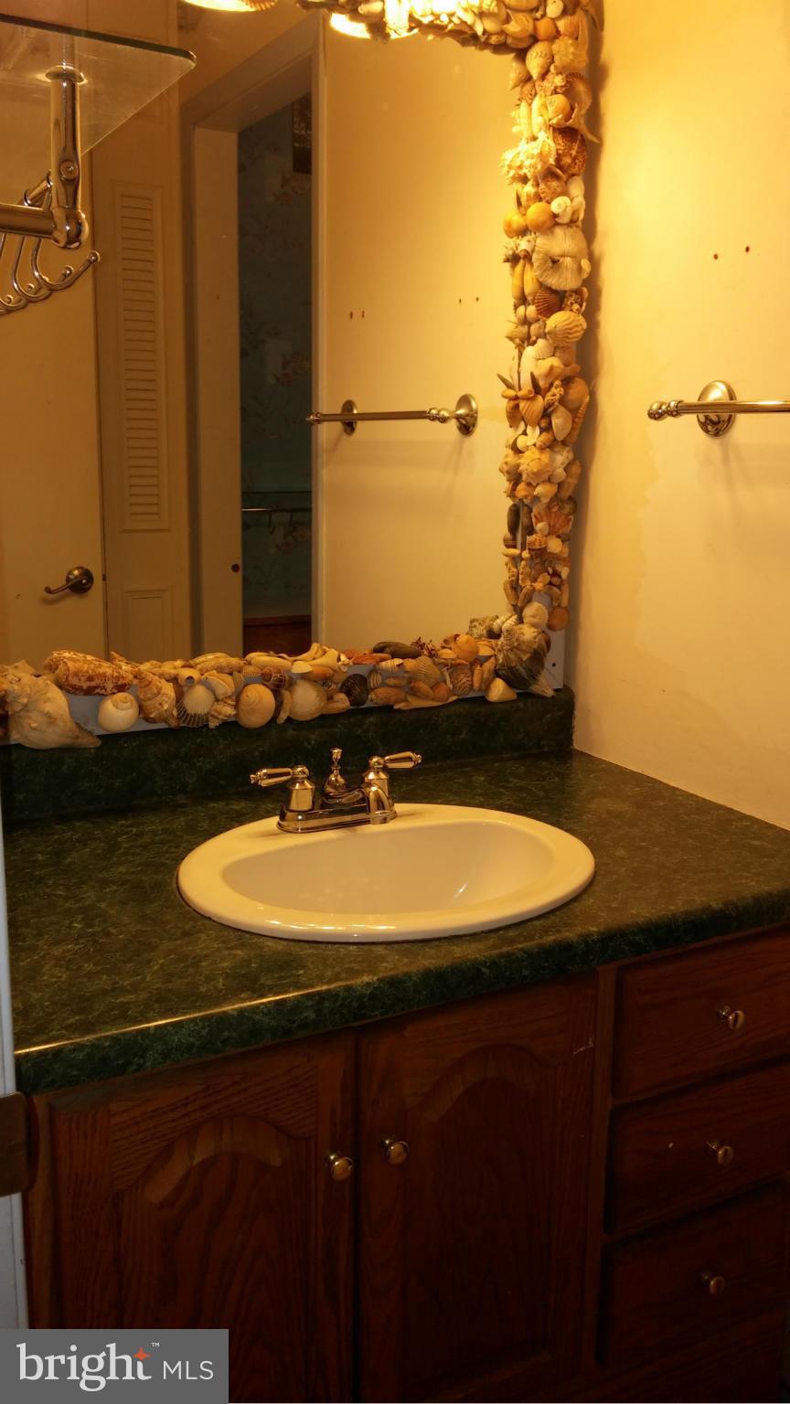 14807 Bottom Road Williamsport, MD 21795 - Photo 17 of 30 a bathroom with a granite countertop sink and a mirror