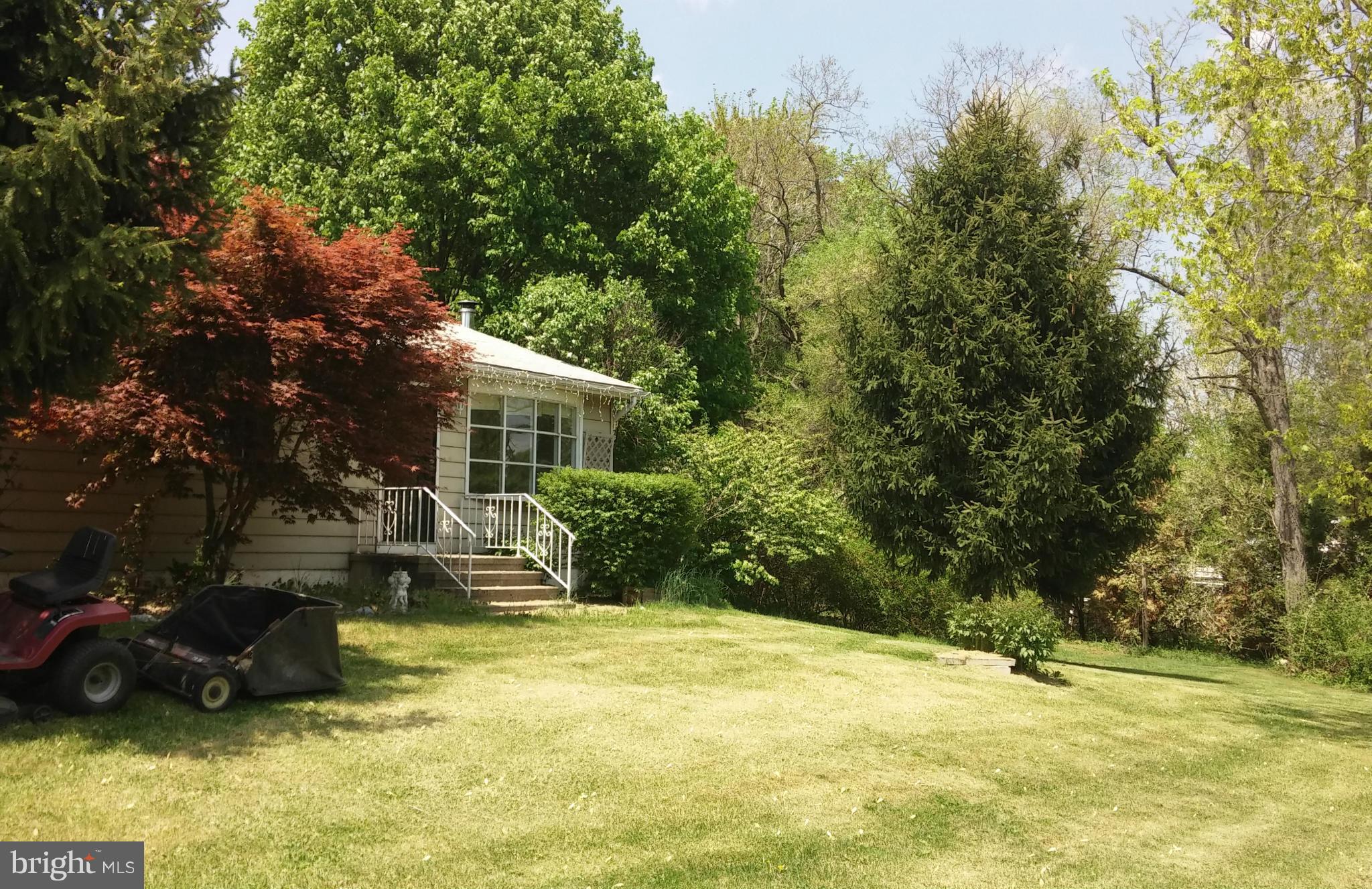 14807 Bottom Road Williamsport, MD 21795 - Photo 5 of 30 a view of a house with a yard and sitting area