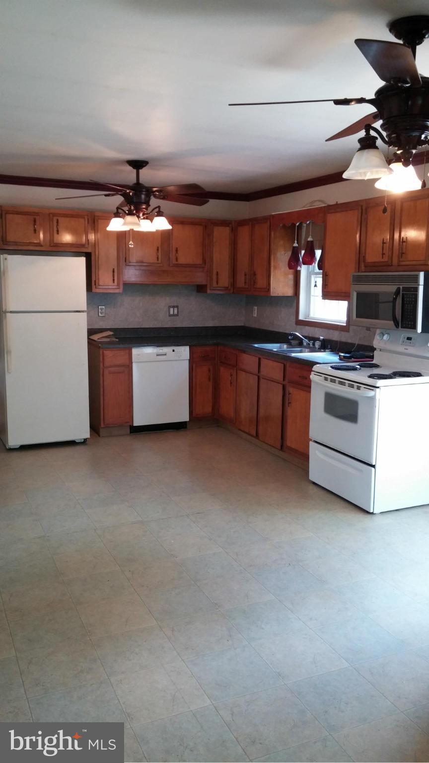 14807 Bottom Road Williamsport, MD 21795 - Photo 10 of 30 a large kitchen with stainless steel appliances granite countertop a stove and a sink