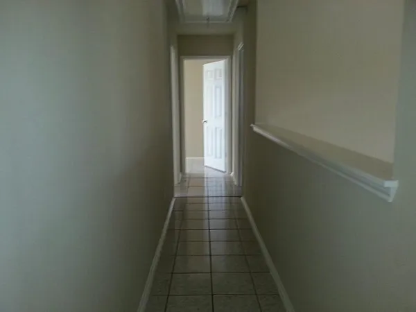 an empty room with a empty space and window