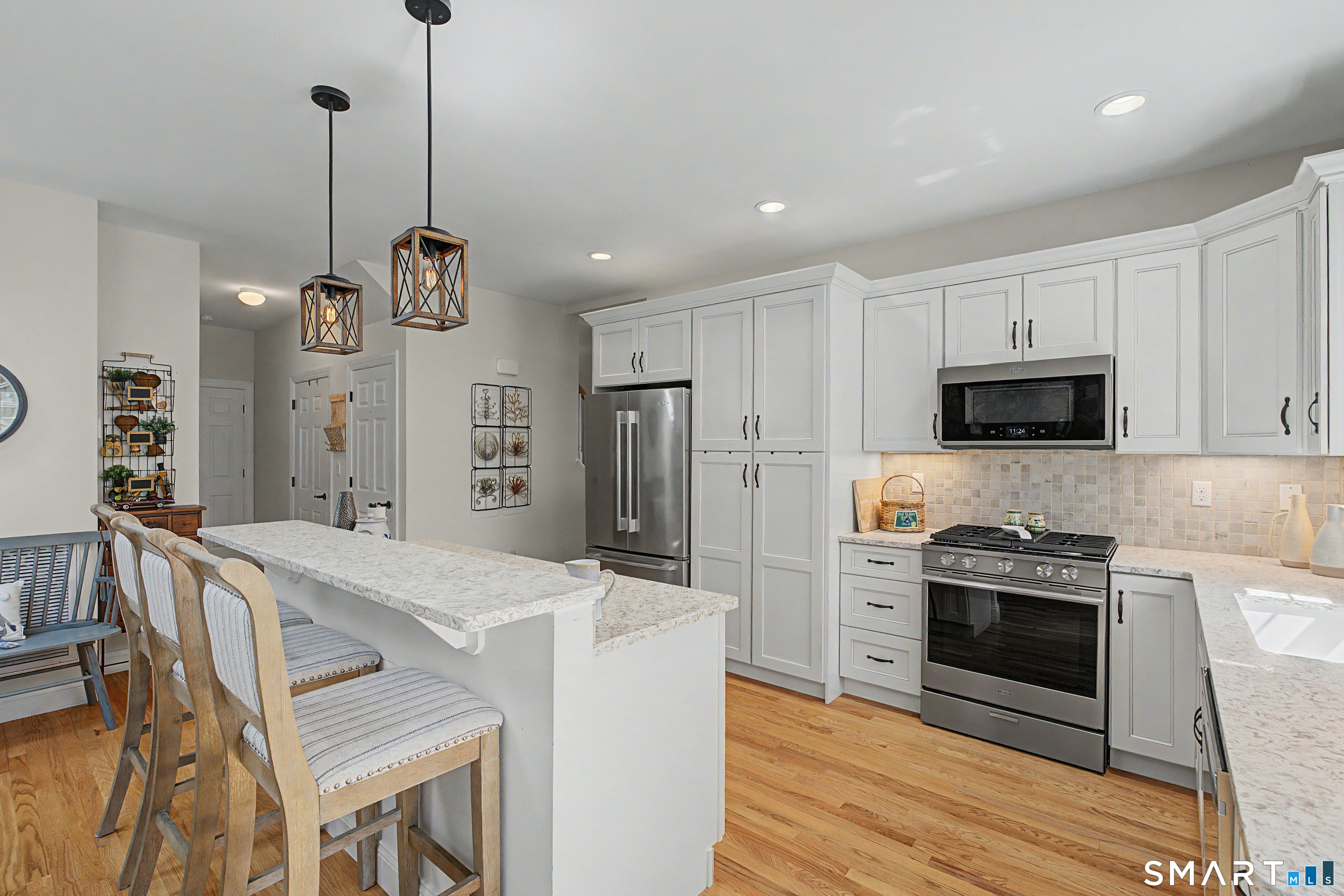 211 Meadowbrook Road, Unit 211 Oxford, CT 06478 - Photo 9 of 38 Beautifully appointed kitchen with abundant cabinetry, stainless steel appliances, and an open layout designed for effortless everyday living and entertaining.