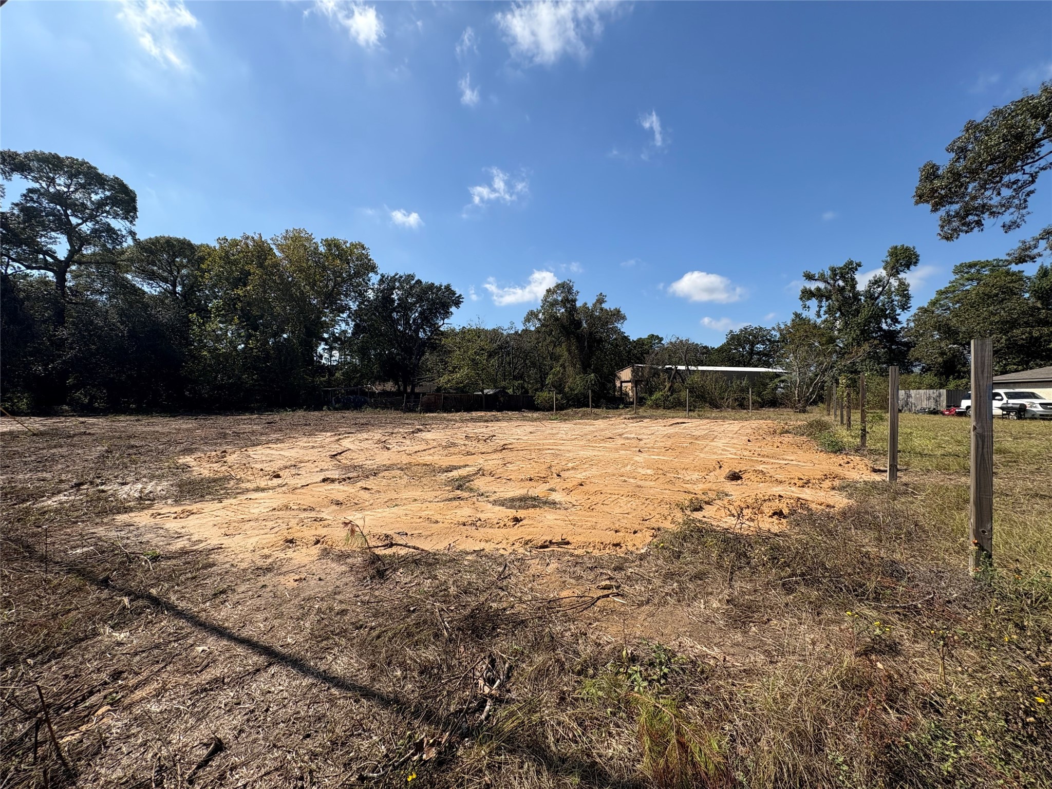 a view of yard with wooden fence