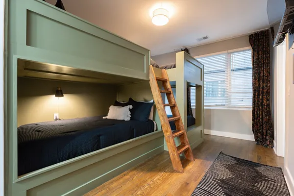 a bedroom with a bed and a window