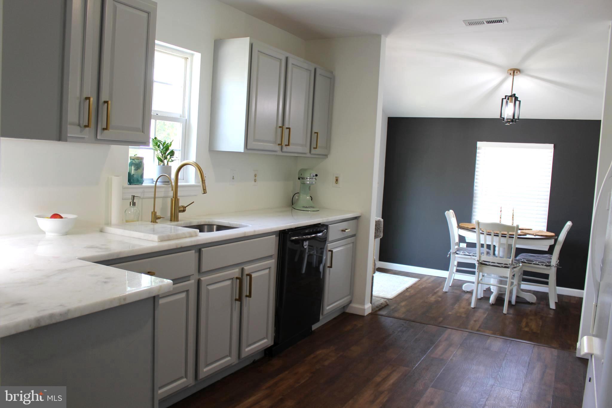 1643 Oldtown Road Edgewater, MD 21037 - Photo 3 of 8 a kitchen with a sink cabinets and wooden floor