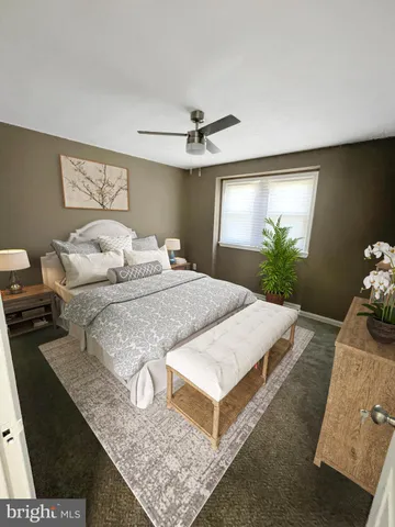 a bedroom with bed and window