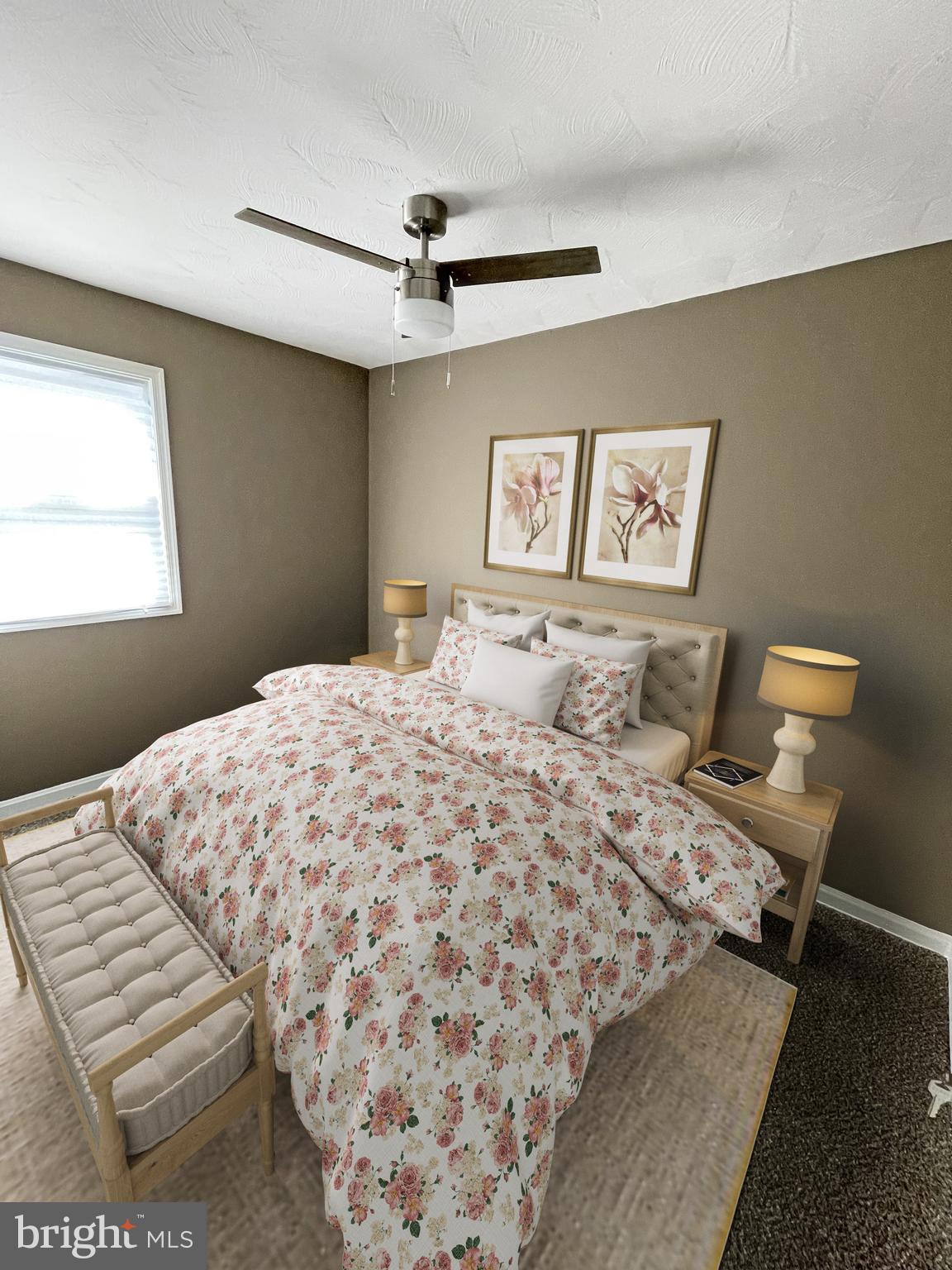 2607 Colebrooke Drive, Unit 21 Temple Hills, MD 20748 - Photo 8 of 9 a bedroom with a bed and a painting on the wall