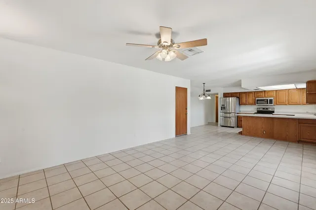 a view of a kitchen with microwave and cabinets