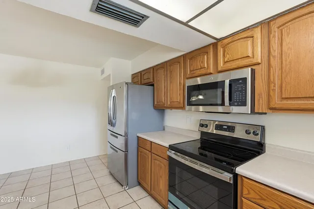 a kitchen with sink and window