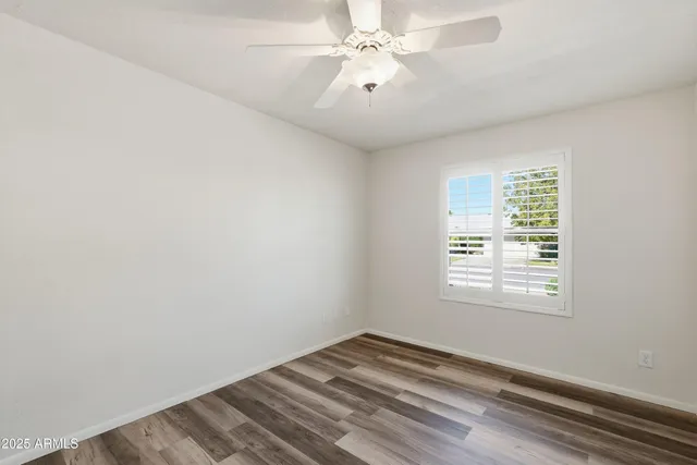 a view of a livingroom with wooden floor and closet