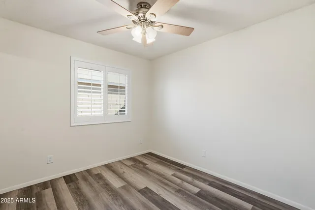 a view of a chandelier fan and entryway