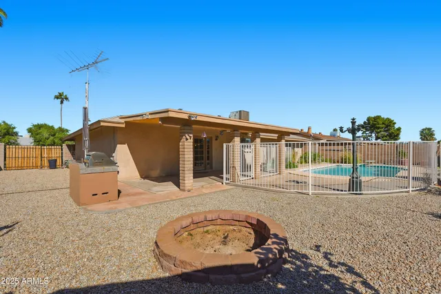 a view of a backyard with plants and lake view