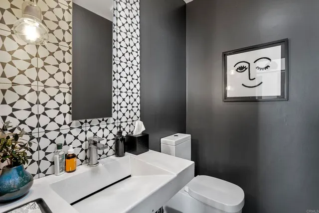 a bathroom with a sink a toilet and a tub