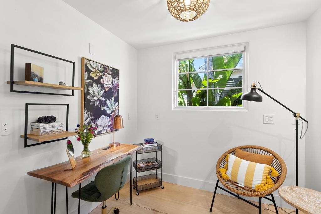 1370 Neptune Avenue Encinitas, CA 92024 - Photo 17 of 31 a living room with furniture and a fireplace