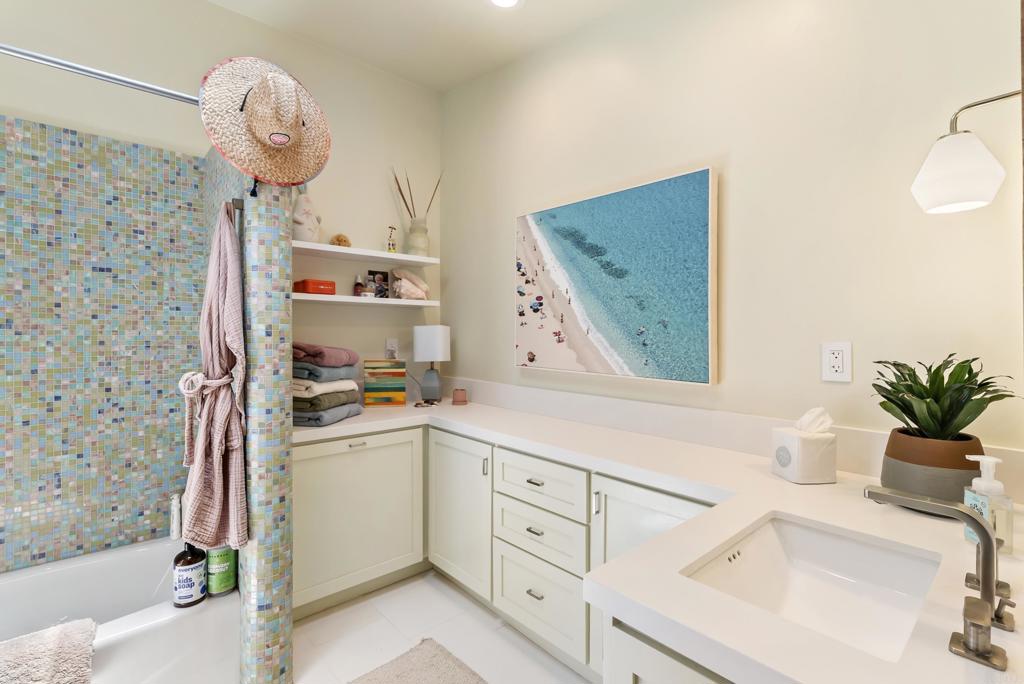 1370 Neptune Avenue Encinitas, CA 92024 - Photo 19 of 31 a kitchen with a sink and a stove