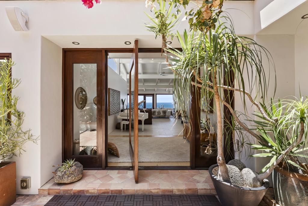 1370 Neptune Avenue Encinitas, CA 92024 - Photo 2 of 31 a front view of a house with garden