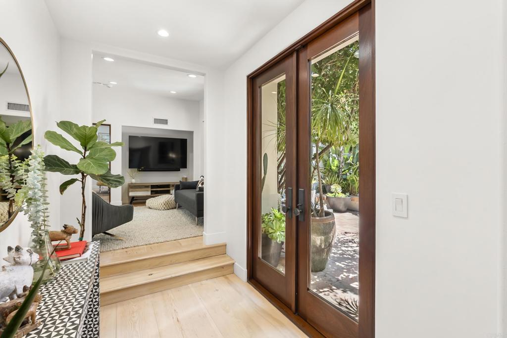 1370 Neptune Avenue Encinitas, CA 92024 - Photo 21 of 31 a living room with furniture and a flat screen tv