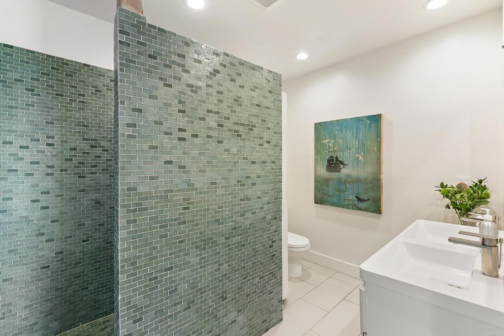 1370 Neptune Avenue Encinitas, CA 92024 - Photo 25 of 31 a bathroom with a shower and a sink